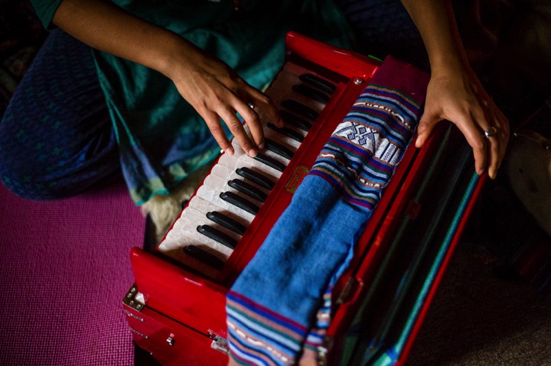 playing harmonium